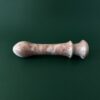 Cherry marble dildo in light — red stone luxury adult toy photography