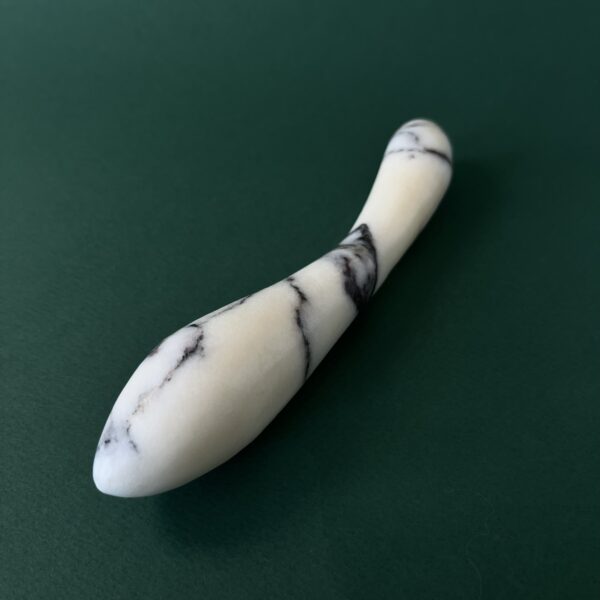 White marble g-spot stimulator detail — hand-carved stone intimate object