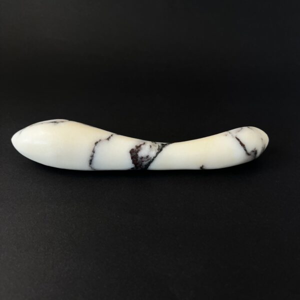 Curved marble dildo profile view — luxury stone g-spot toy