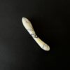 White marble g-spot stimulator studio photography — luxury stone intimate toy